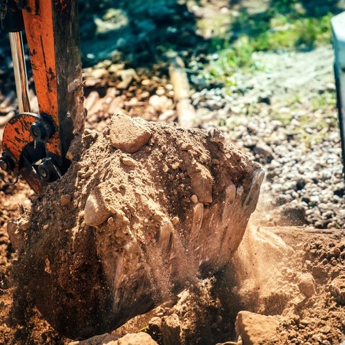 close-up of an excavator moving dirt